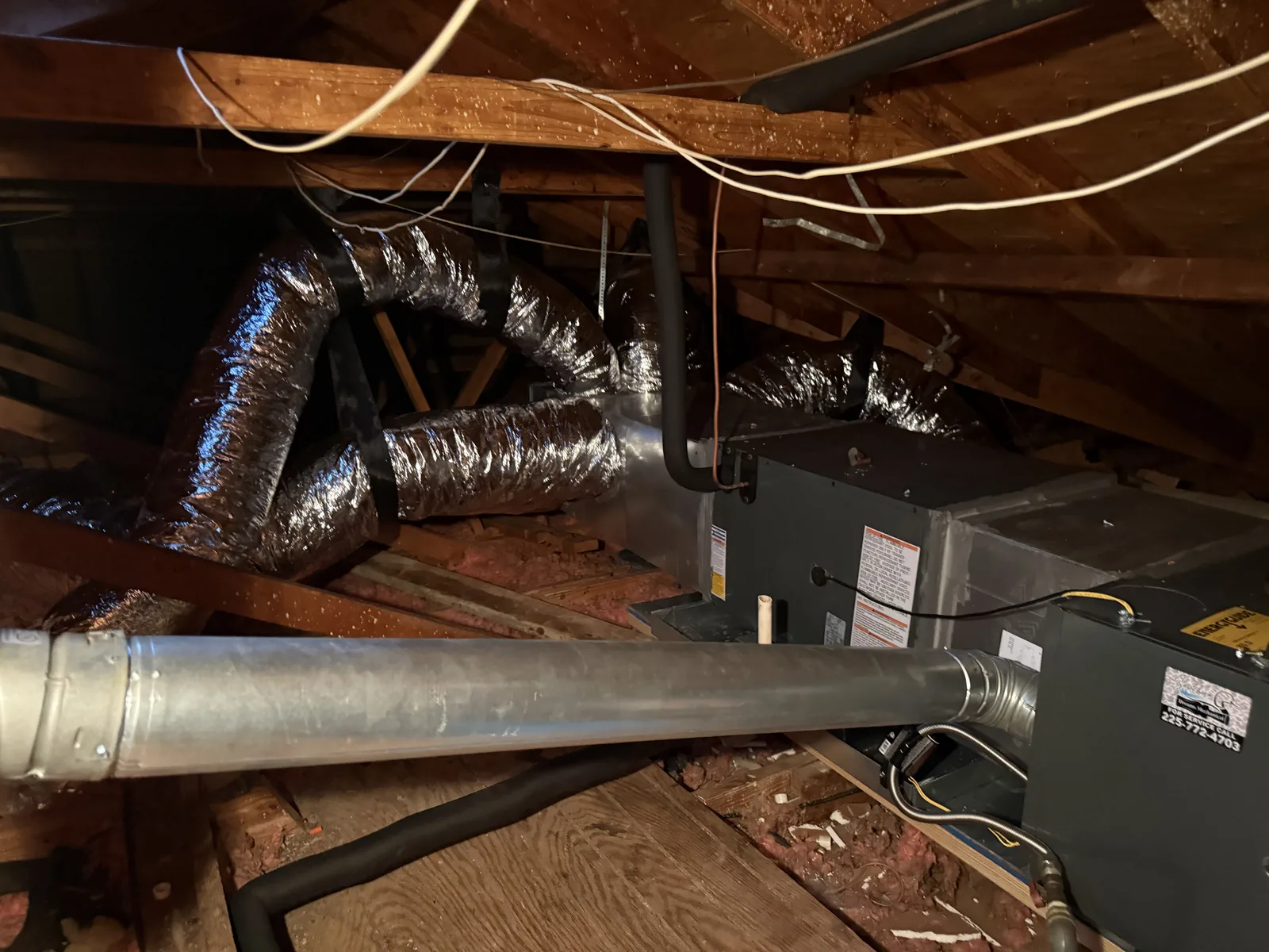 Insulated flexible ductwork runs connected to an attic air handler in a Louisiana home.